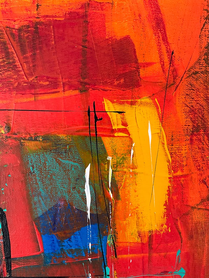 Dynamic abstract artwork featuring vivid reds, blues, and yellows.